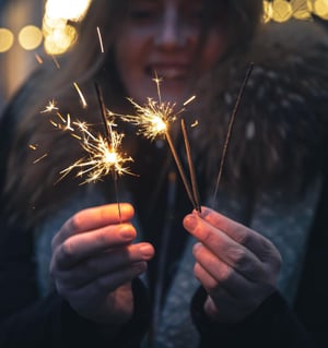 burning-sparklers-hands-young-woman-dark