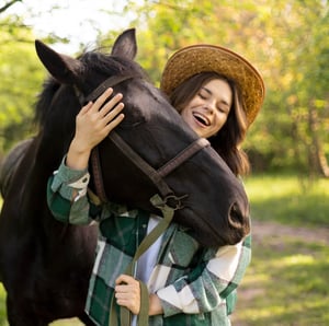 medium-shot-happy-woman-horse-1